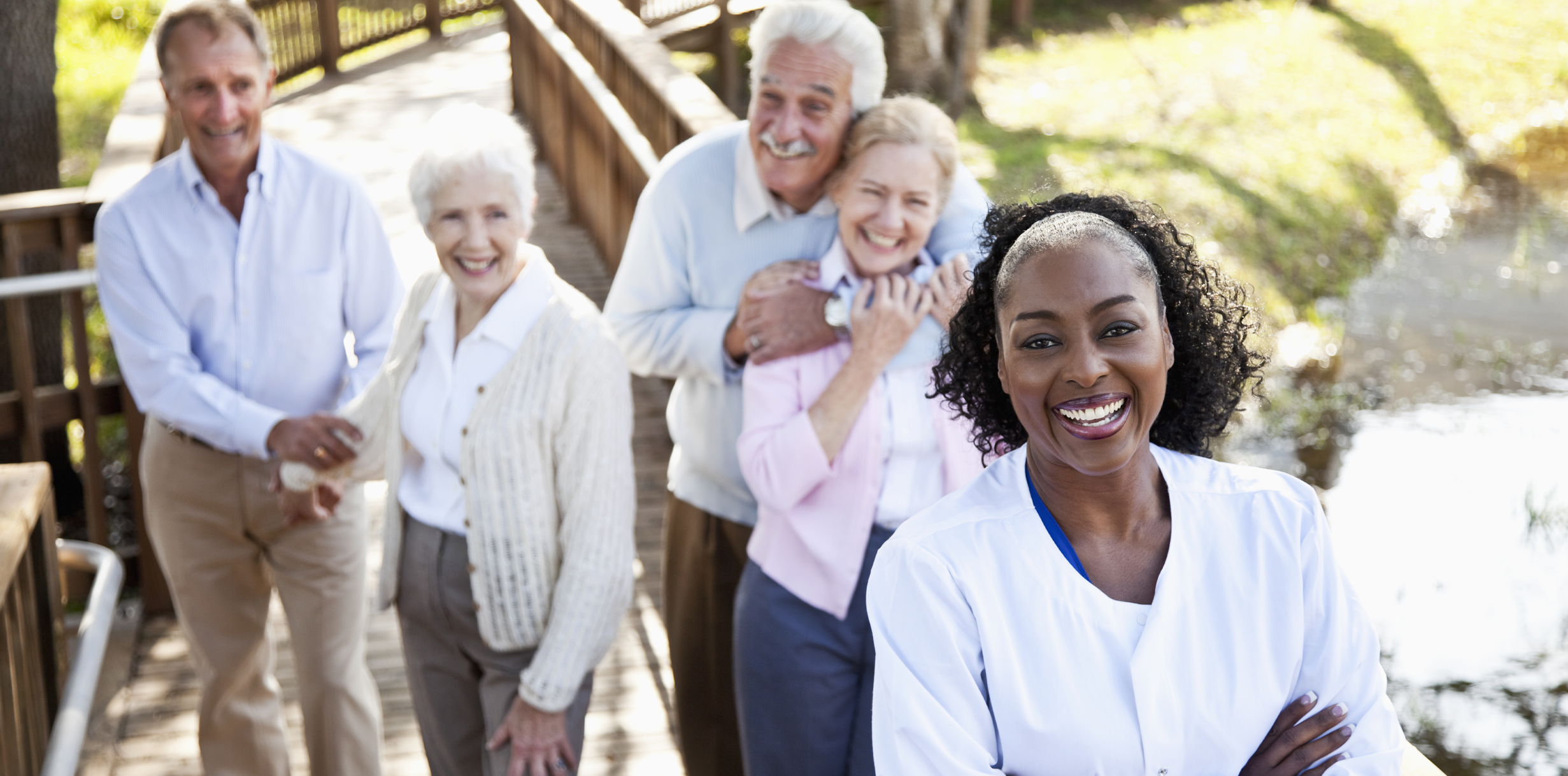 Smiling Senior Couple with Nurse