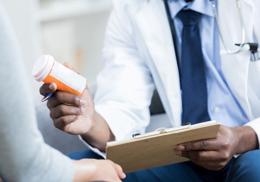 Doctor handing prescription Doctor handing prescription
